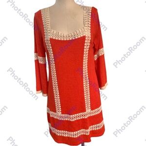 Judith Match, Medium, Orange dress with white crochet throughout dress.